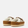 Evx Braune Mules aus Lammfell